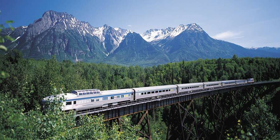 Luxury train moving through Canadian Rockies